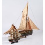 Painted wooden model sailing barge, with maroon and black painted hull, with two masts, 59cm long,