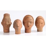 Four Nigerian Nok terracotta heads, the largest 22cm high (4)