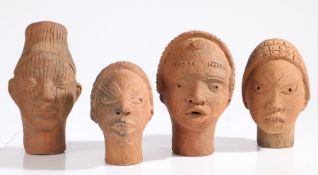 Four Nigerian Nok terracotta heads, the largest 22cm high (4)