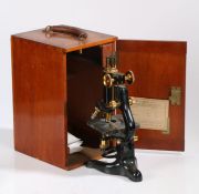 Mid 20th century 'Service' microscope, by W. Watson & Sons Ltd., in black lacquer, with mahogany
