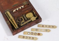 19th Century lacquered brass monocular pocket microscope, with four bone slides, housed in a