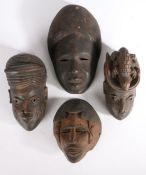 Four West African tribal masks, the largest 27cm (4)