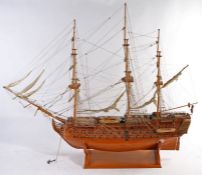 Wooden model of the H.M.S. Victory, presented on a plinth base, 163cm high, 192cm long