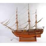 Wooden model of the H.M.S. Victory, presented on a plinth base, 163cm high, 192cm long