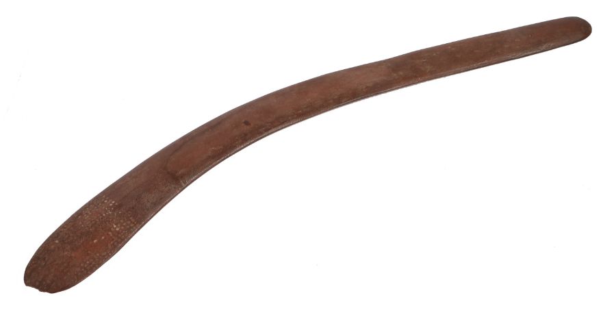 19th Century aboriginal boomerang, of typical curved form with remains of white dot decoration to