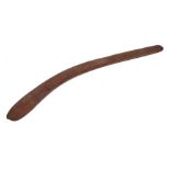 19th Century aboriginal boomerang, of typical curved form with remains of white dot decoration to