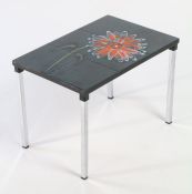 Tile topped table. The top inset with six floral tiles depicting an orange flower, raised on