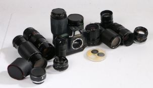 Canon T90 togeter with a Collection of Lenses including Canon and Minolta Lenses