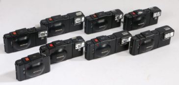 Eight Olympus XA Cameras, including two XA3 and one XA2 cameras (8)