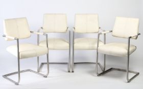 A set of 4 Xooon leather and chrome chairs in white. 86cm tall.