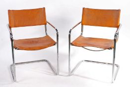 A pair of Fasem 5 83 tan Leather Chairs. 80cm x 56cm x 53cm.
