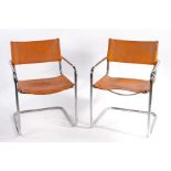 A pair of Fasem 5 83 tan Leather Chairs. 80cm x 56cm x 53cm.