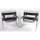 Pair of Leather and Chrome Chairs in the style of Fasem Wassily, in black. 78cm x 73cm x 70cm.