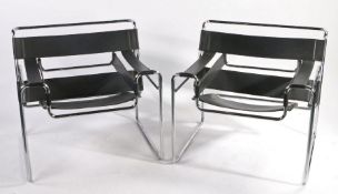 Pair of Leather and Chrome Chairs in the style of Fasem Wassily, in black. 78cm x 73cm x 70cm.