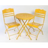 Set of three 20th Century folding painted metal garden table and chairs, the chairs with a wavy