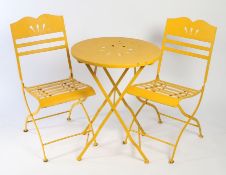 Set of three 20th Century folding painted metal garden table and chairs, the chairs with a wavy