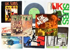 A collection of U.K. Subs 7" singles - Keep On Running (Til You Burn) ( GEMS 45 , blue vinyl) /