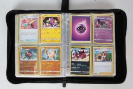 A collection Pokémon cards housed in a Pikachu folder.