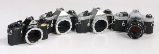 Four Pentax cameras including two ME super, one ME and a MX Asahi with a Pentax SMC 1:1.7 50mm lens