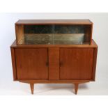 A mid-century Teak cocktail cabinet. The top section with sliding glass with a mirrored interior,