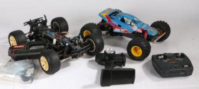 A collection 5 of remote control cars to include a Tamiya 'Mad Bull',  another electric example, and
