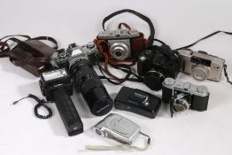 Collection of cameras, to include Canon AE-1 3745886 with Tamron SP 70-210mm 1:3.5 lens, Canon