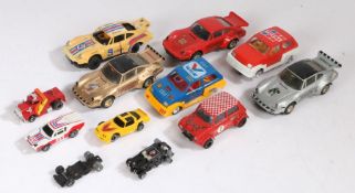 A collection of Scalextrix cars to include a Mini, Porsches and Metros. Also includes some smaller