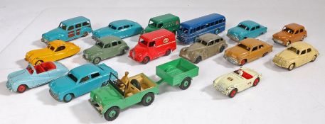 A collection of Dinky Toys diecast models and a small tin of spare tyres