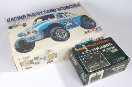 A Tamiya Racing Buggy Sand Scorcher (lacking body) together with an Acoms AP-227 Mk II radio control