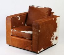 Joris cowhide chair in the Art Deco manner. 86cm x 86cm x 75cm