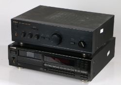 Kenwood Multiple Compact Disc Player, DP-M5570, serial no. 50440663, and an Aiwa Stereo Integrated
