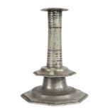 A rare Charles II pewter pillar stem and octagonal-base candlestick, circa 1685 The slightly waisted
