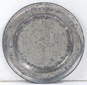 A William & Mary pewter wrigglework plate, circa 1690 Having a single-reeded rim, with meandering