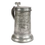 A rare William & Mary pewter Beefeater flagon, circa 1700 The straight-sided drum hammered all-over,