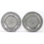 A rare pair of Queen Anne pewter single-reed rim wrigglework marriage plates, circa 1710 Each rim