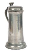 A Charles I pewter flagon, Berkshire, circa 1630 Having a plain tapering drum with paired incised