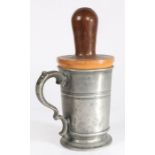 A George III pewter quart mug with impressive lignum vitae re-former or jack, circa 1800 The