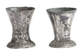 A near pair of pewter miniature beakers, circa 1600 Each with slender flared drum, on a spreading