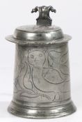 A delightful Charles II pewter wrigglework flat-lid tankard, unusually designed with an owl,
