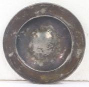 An early to mid-16th century pewter spice plate, circa 1500-50 Having a single reeded broad rim,