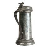 A Charles I pewter flagon, circa 1630-40 Having a tapering drum, with ovolo-moulded collar and