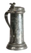 A Charles I pewter flagon, circa 1630-40 Having a tapering drum, with ovolo-moulded collar and