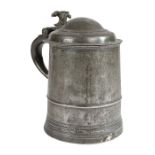 A Queen Anne pewter domed-lidded straight-sided tankard, circa 1710 The drum with low narrow fillet,