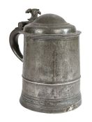 A Queen Anne pewter domed-lidded straight-sided tankard, circa 1710 The drum with low narrow fillet,