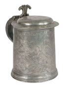 A William & Mary pewter flat-lid wrigglework tankard, circa 1690 The drum designed with three