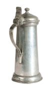 A small James I pewter flagon, circa 1620 Having a plain tapering drum, bun lid with flattened-