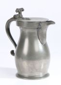 A George II pewter double-volute spouted baluster measure, circa 1750 OEWS quart, having a plain