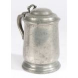 An early 19th century pewter pint tulip-shaped domed-lidded tankard, English, circa 1825 Having a