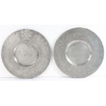 A rare pair of Charles II pewter broad rim plates, circa 1660 Each rim engraved with the mantled