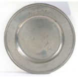 An early 18th century pewter multi-reed charger, Somerset, circa 1700-20 The semi-broad rim with